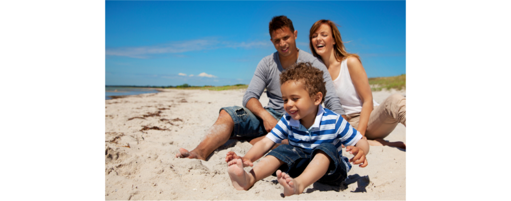 young family enjoys their vacation on a bright sunny beach SBI 301327007 2 1